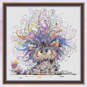 May include: A colorful cross-stitch pattern of a cat with a whimsical, swirling design in its fur. The cat has large, expressive eyes and a playful expression.