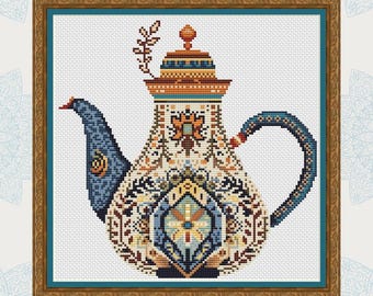May include: A colorful ceramic teapot with intricate floral and geometric patterns in shades of blue, orange, yellow, and green. The teapot has a lid with a knob and a spout. The teapot is framed in a gold frame.