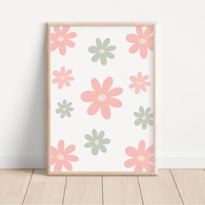 May include: A framed print with a white background and a pattern of pink and green flowers. The flowers are stylized and have a simple design.