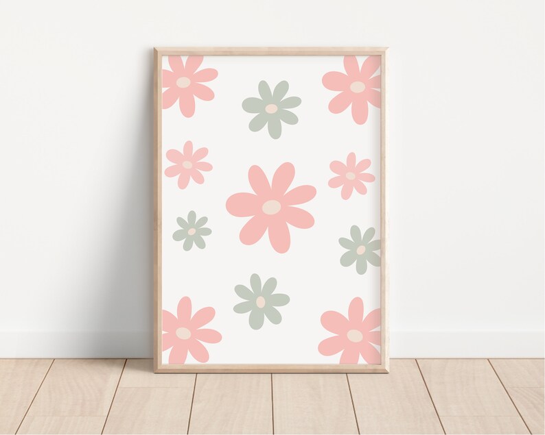 May include: A framed print with a white background and a pattern of pink and green flowers. The flowers are stylized and have a simple design.
