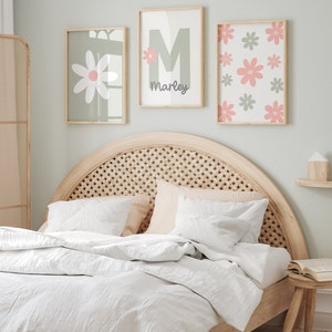 May include: Three framed prints with a green background and pink flowers. The center print has a large green letter M and the name "Marley" written below it.