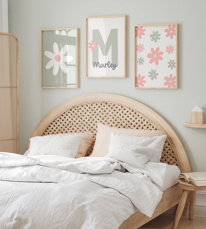 May include: Three framed prints with a green background and pink flowers. The center print has a large green letter M and the name "Marley" written below it.