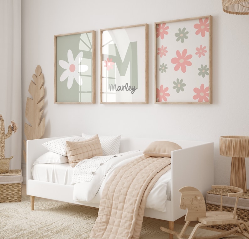 May include: Three framed prints with a green background and pink flowers. The middle print has the name "Marley" written in cursive.