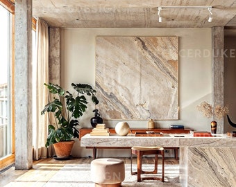 May include: A modern living room with a large, abstract painting on the wall, a large potted plant, a long marble table with a stool, and a bookshelf filled with books.