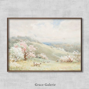 Op de afbeelding: Een aquarel schilderij van een landelijk landschap met een glooiende groene heuvel, een groep bomen met roze en witte bloesems en een kudde schapen die grazen in een weide. De lucht is zachtblauw met pluizige witte wolken.