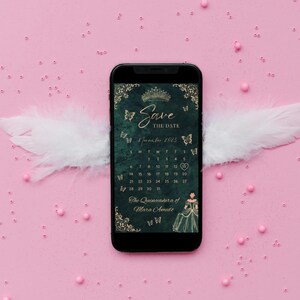 May include: A smartphone displays a Save the Date invitation for a quinceañera. The screen features a dark green background with gold accents, a crown, butterflies, and a calendar for November 2025. White feathers and pink beads surround the phone.