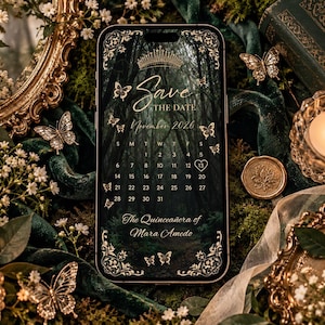 May include: A smartphone displaying a digital Save the Date calendar for November 2026, featuring a dark forest background, gold crown, and butterfly accents. The text reads Save the Date, November 2026, and The Quinceañera of Mara Amedo, with a heart around the 13th.