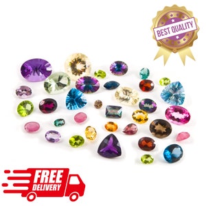 May include: A collection of various gemstones in different shapes and colors, including oval, round, and triangular cuts. The gemstones are in shades of purple, green, blue, yellow, and brown. A gold seal with the text "BEST QUALITY" is visible.