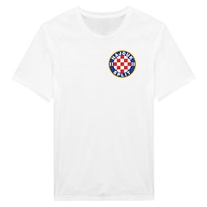 May include: White t-shirt with a blue and red circular logo that says "Hajduk Split" in white letters.
