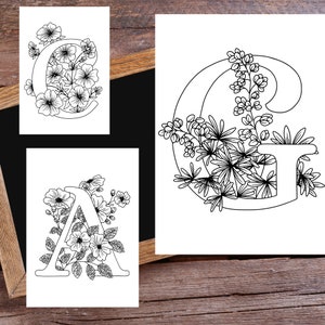 May include: Three printable coloring pages featuring the letters A, C, and G decorated with floral designs. Each letter is surrounded by flowers and leaves.