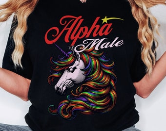 May include: Black t-shirt with a rainbow unicorn graphic and the text "Alpha Male" in red.
