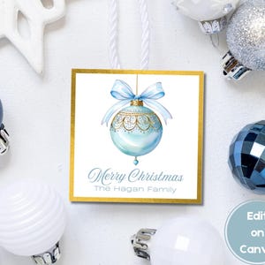 May include: A blue and gold Christmas ornament gift tag with the text "Merry Christmas The Hagan Family".