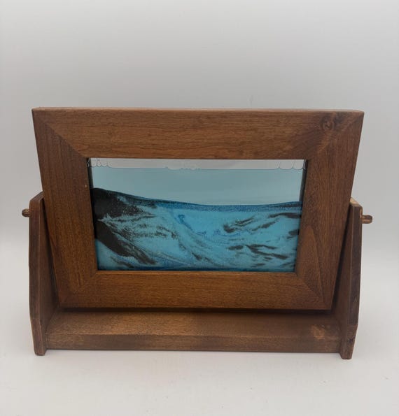 A signed vintage William Tabar sand picture from Park City, Utah — a real named artist's kinetic work where ocean-blue sands shift into ever-changing landscapes with every tilt.