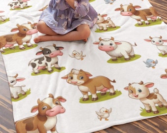 Manta infantil de veludo macio, com estampa de vacas e cabras, ideal para o quarto do bebê.