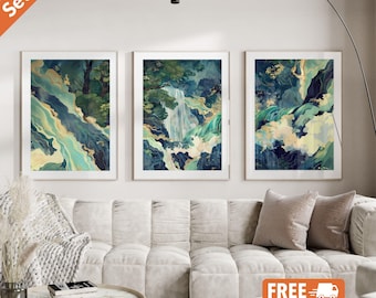 May include: Set of three abstract landscape wall art prints. Each print features a blue, green, and gold watercolor-style design with a waterfall and mountains. The prints are framed in white.