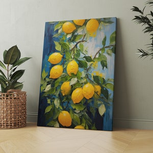 An original oil painting canvas print of vibrant lemons against a blue background. Available in multiple seizes with free shipping. Pictured leaning on a wall