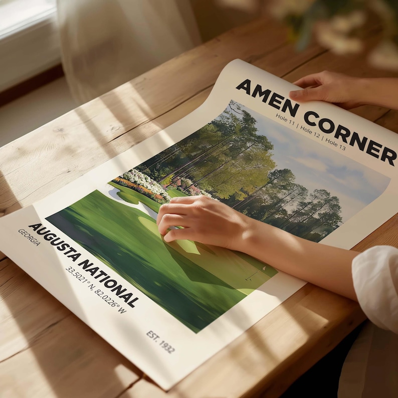 The famous Amen Corner at Augusta golf poster, great golfer gift wall art print. Showing the poster being unrolled on a light table.