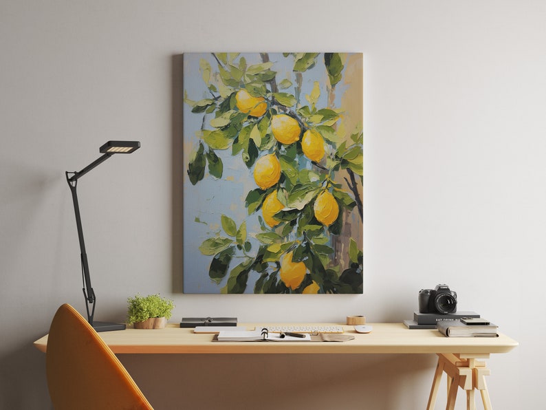 An oil painting canvas print of yellow lemons and leaves against a blue background. Available in multiple sizes with free shipping. Pictured hanging above a desk