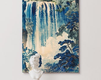 May include: A vintage Japanese woodblock print depicting a waterfall cascading down a rocky cliffside. Lush green trees and blue water surround the waterfall. The print is framed and displayed on a white wall.