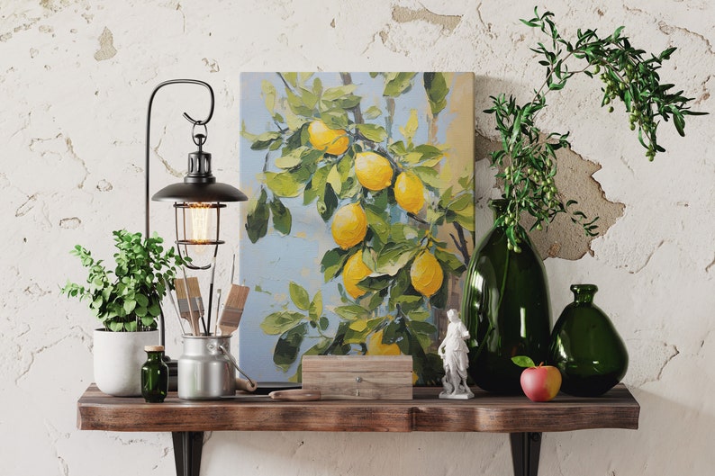 An oil painting canvas print of yellow lemons and leaves against a blue background. Available in multiple sizes with free shipping. Pictured leaning on a shelf