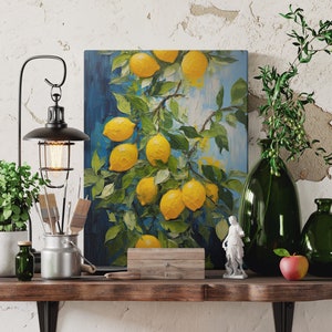 An original oil painting canvas print of vibrant lemons against a blue background. Available in multiple seizes with free shipping. Pictured leaning on a shelf