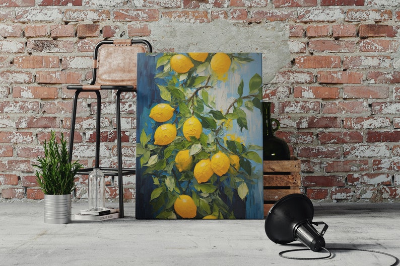 An original oil painting canvas print of vibrant lemons against a blue background. Available in multiple seizes with free shipping. Pictured leaning on a wall