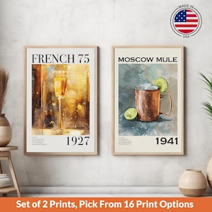 A set of 2 vintage bar cocktail drink wall art posters with recipes & the year created. Choose 2 from our 17 designs. Available in multiple sizes with free shipping. (Poster only no frame included, shown framed for illustration purposes only)