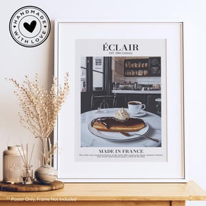 May include: A vintage-style poster with a white background and black text. The poster features a drawing of a chocolate éclair pastry with whipped cream on top. The text on the poster reads "ÉCLAIR EST. 19th Century MADE IN FRANCE The éclair was created in France in the early 19th century by Marie-Antoine Carême, one of the most famous pastry chefs of the time."