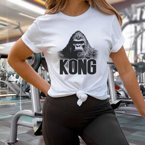 Premium unisex gorilla graphic T-shirt crafted from soft, high-quality fabric. Perfect for fans of iconic movie characters or bold, nature-inspired apparel.