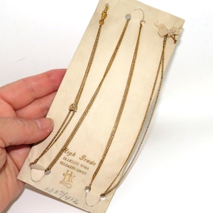 May include: Three gold chains on a white card with the text "High Grade Stainless Wire Soldered Links HK 1287/412".