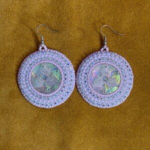 May include: A set of three ceramic mugs with a speckled, matte finish in cream, light grey, and dark grey. Each mug has a simple, minimalist design, suitable for coffee or tea.