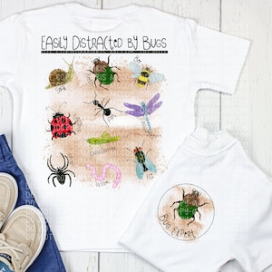 May include: White t-shirt with a brown and white graphic of various bugs and the text "Easily Distracted by Bugs". The back of the shirt has a circle with the text "Bug Expert" and a green beetle.