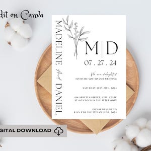 Könnte beinhalten: Eine minimalistische Hochzeitseinladung mit einem floralen Design und dem Text "MADELINE And DANIEL" und "M|D 07.27.24 We are delighted to invite you to our wedding SATURDAY, JULY 27TH, 2024 456 ARBUTUS STREET, CITY, STATE AT O'CLOCK IN THE AFTERNOON PLEASE BE SURE TO R.S.V.P BY THE 27TH OF JUNE, 2024"