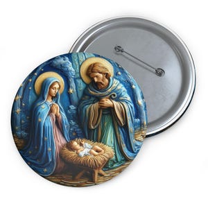 May include: A round button featuring a depiction of the nativity scene. Mary, Joseph, and baby Jesus are depicted in a blue and gold setting with a starry night sky.