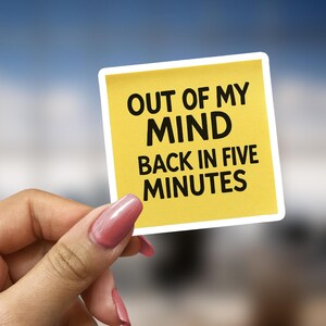 May include: Yellow sticky note with the text "Out of my mind, back in five minutes".