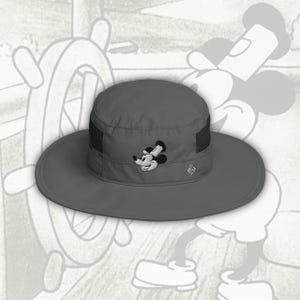 May include: Gray sun hat with a wide brim and a mesh panel. The hat features an embroidered Mickey Mouse design on the front. The Columbia logo is visible on the side. The hat is designed for sun protection.