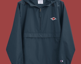 May include: A navy blue Champion windbreaker with a zip fastening and a red and white logo on the left chest. The logo is a stylised ship's wheel with a red heart in the centre.