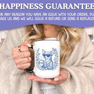May include: White ceramic mug with a black handle and rim, featuring a blue illustration of a chihuahua wearing sunglasses and a robe, holding a coffee cup. The mug has the text "But first, coffee". The text "HAPPINESS GUARANTEE" is at the top.