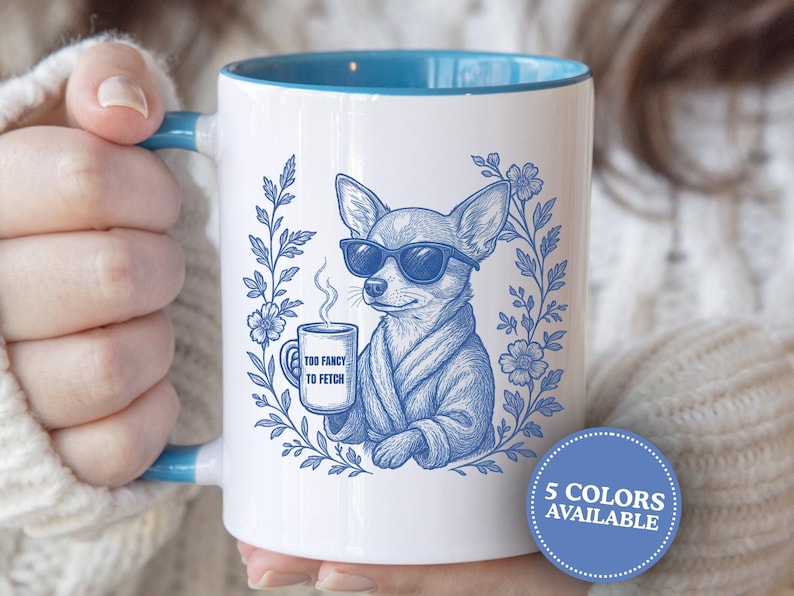 May include: White ceramic mug with a blue interior and handle. The mug features a blue illustration of a chihuahua wearing sunglasses and a robe, holding a mug with the text "Too Fancy to Fetch". Decorative floral elements surround the dog.