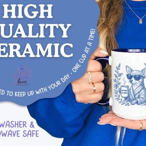 May include: A white ceramic mug with a blue interior and handle, featuring a blue illustration of a chihuahua wearing sunglasses and holding a coffee cup. The mug has text that reads "HIGH QUALITY CERAMIC" and "DISHWASHER & MICROWAVE SAFE".