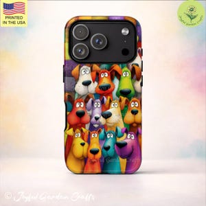 May include: A colorful phone case featuring a cartoon illustration of various dogs with different colors and expressions. The case has a black border and the text "PRINTED IN THE USA". The design includes the text "Joyful Garden Crafts".
