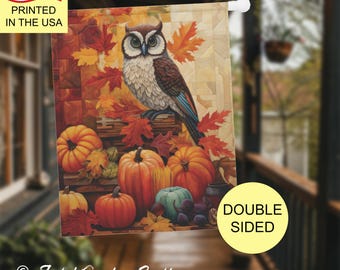 May include: Double-sided garden flag featuring an owl perched on a log, surrounded by pumpkins and autumn leaves. The flag has the text "Printed in the USA" and "Double Sided". The flag is from "Joyful Garden Crafts".