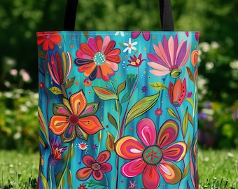 May include: A turquoise tote bag with a colorful floral pattern. The flowers are painted in shades of pink, orange, red, and yellow. The bag has a black canvas handle.