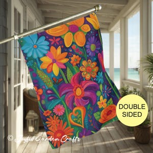 May include: Double-sided garden flag with a vibrant floral design. The flag features a dark blue background with colorful flowers in shades of orange, yellow, pink, purple, and blue. The text "Joyful Garden Crafts" is visible at the bottom.