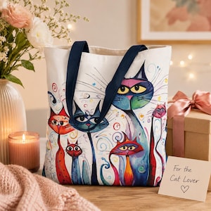 Artistic cat lover tote bag featuring vibrant whimsical cat illustrations in a cozy European-style street café setting