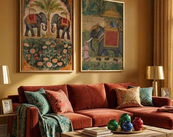 May include: Two framed wall art prints featuring traditional Indian elephant illustrations. The left print shows two elephants near a palm tree and flowers. The right print depicts an elephant carrying a golden canopy with riders in a garden setting.