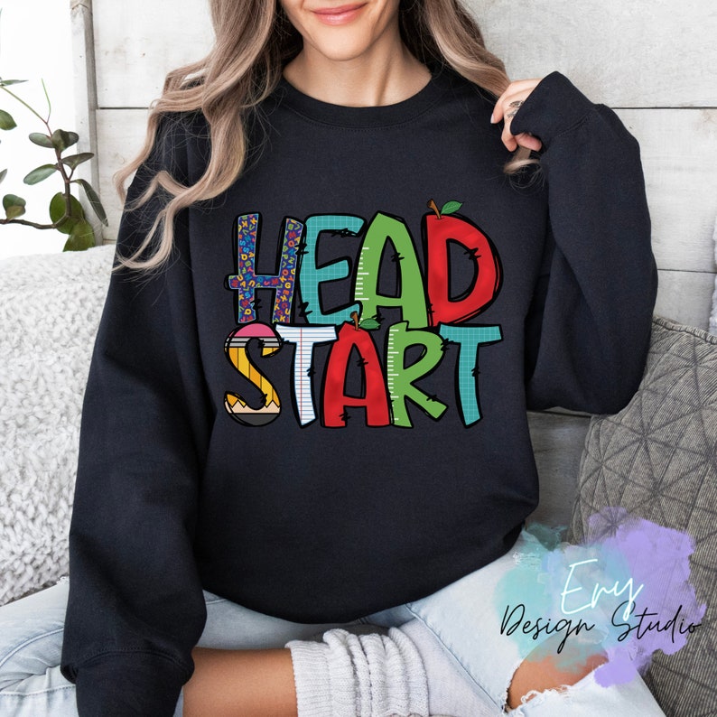 May include: Black sweatshirt with the text "HEAD START" in colorful letters with a pencil, ruler, and apple graphic.
