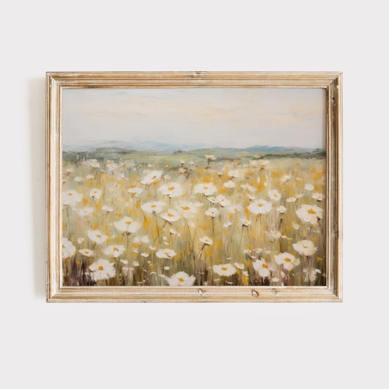 May include: A framed painting of a field of white wildflowers with a soft, blurred background of a distant landscape. The painting is done in a painterly style with visible brushstrokes.