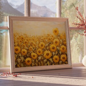 May include: A framed painting of a field of sunflowers in shades of yellow and brown. The sunflowers are in various stages of bloom, with some facing the viewer and others facing away. The painting is set against a light background.