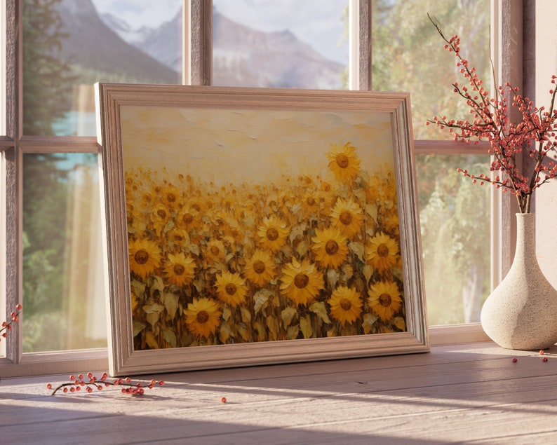 May include: A framed painting of a field of sunflowers in shades of yellow and brown. The sunflowers are in various stages of bloom, with some facing the viewer and others facing away. The painting is set against a light background.